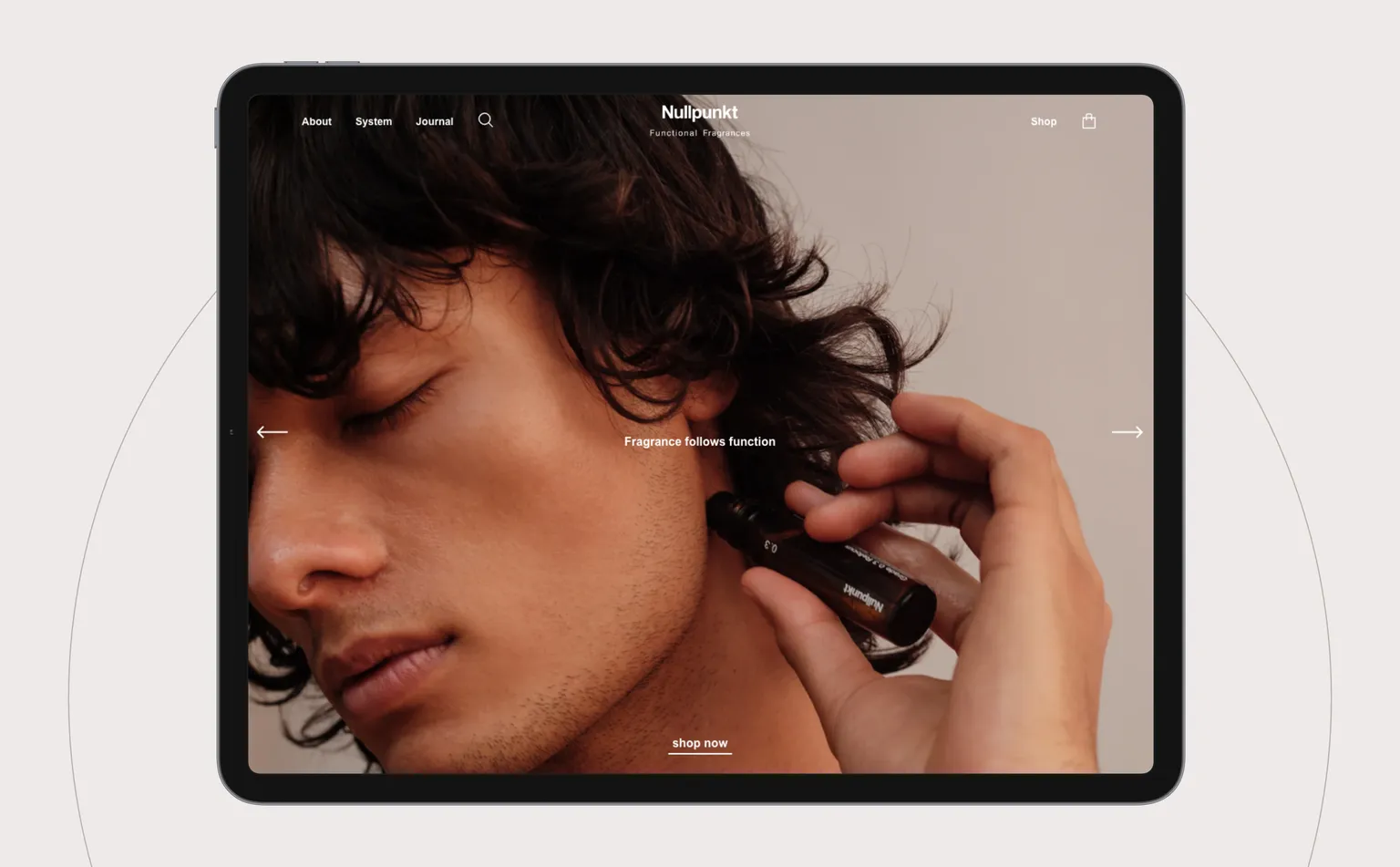 An iPad mockup showing the website's landing page